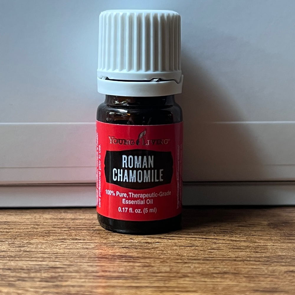 Young Living Roman Chamomile Oil in Red and White